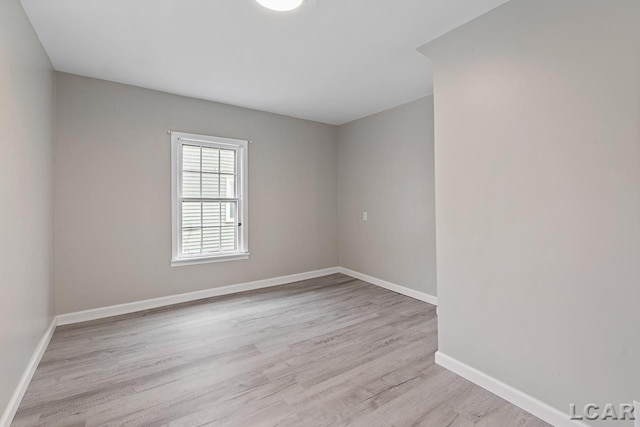 empty room with light hardwood / wood-style floors