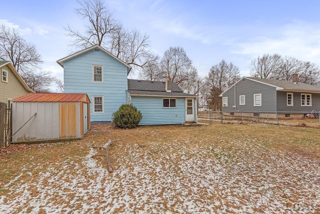 back of property with a storage unit