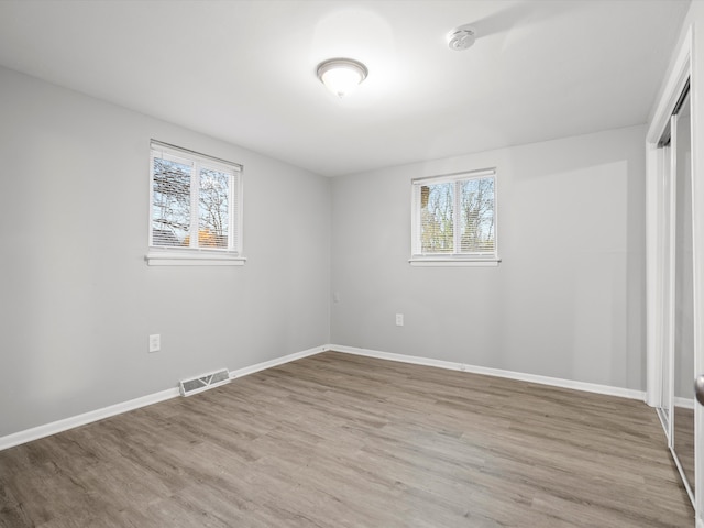 spare room with light wood-type flooring