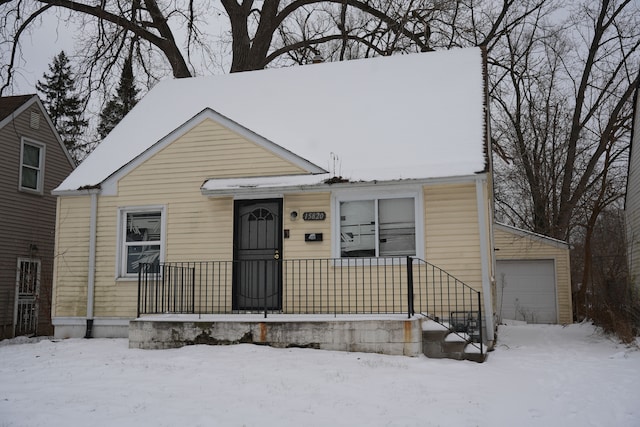 view of front of house featuring a garage and an outdoor structure