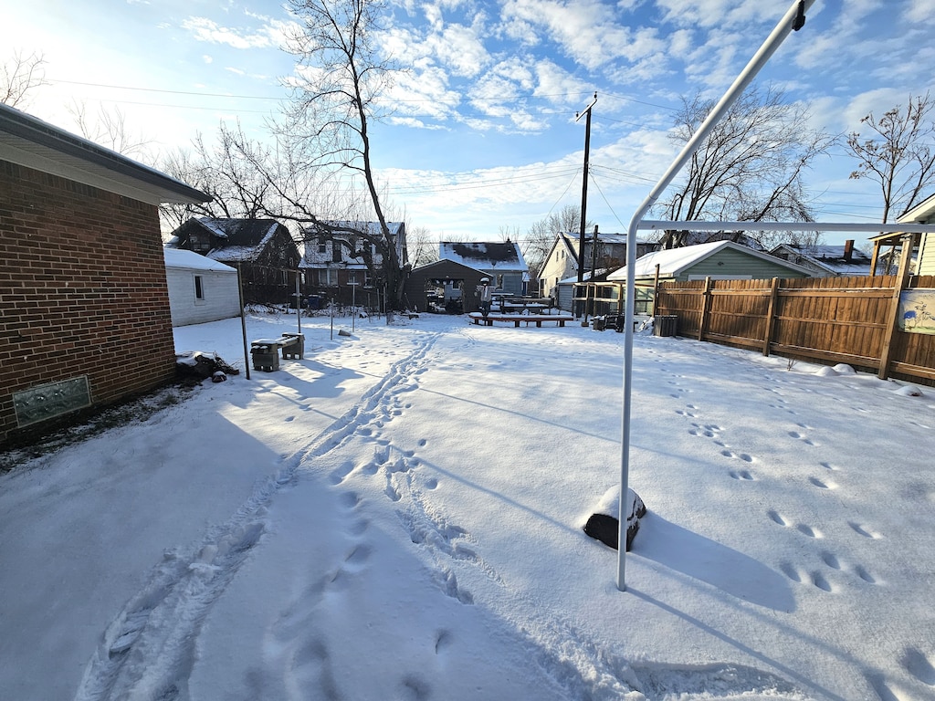 view of yard layered in snow