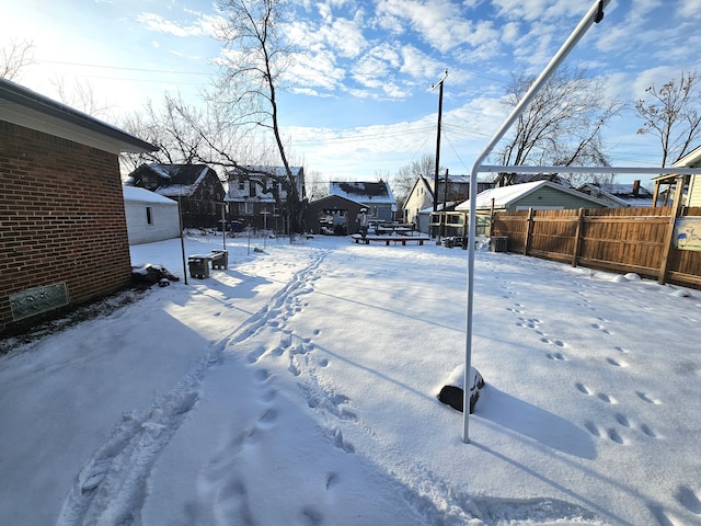 view of yard layered in snow