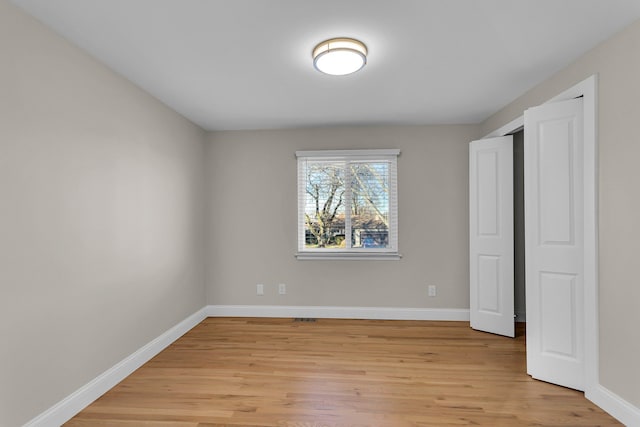 unfurnished bedroom with light wood-type flooring