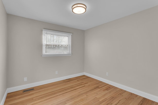 unfurnished room with light hardwood / wood-style flooring