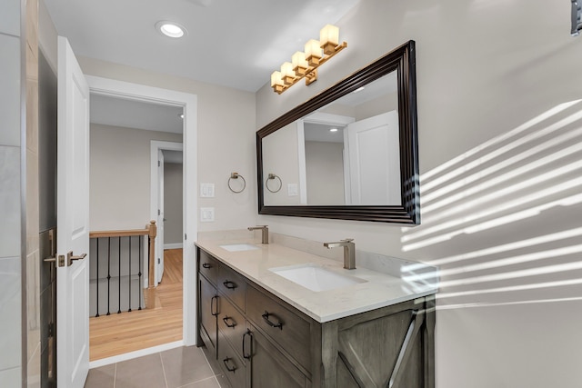 bathroom with tile patterned floors and vanity