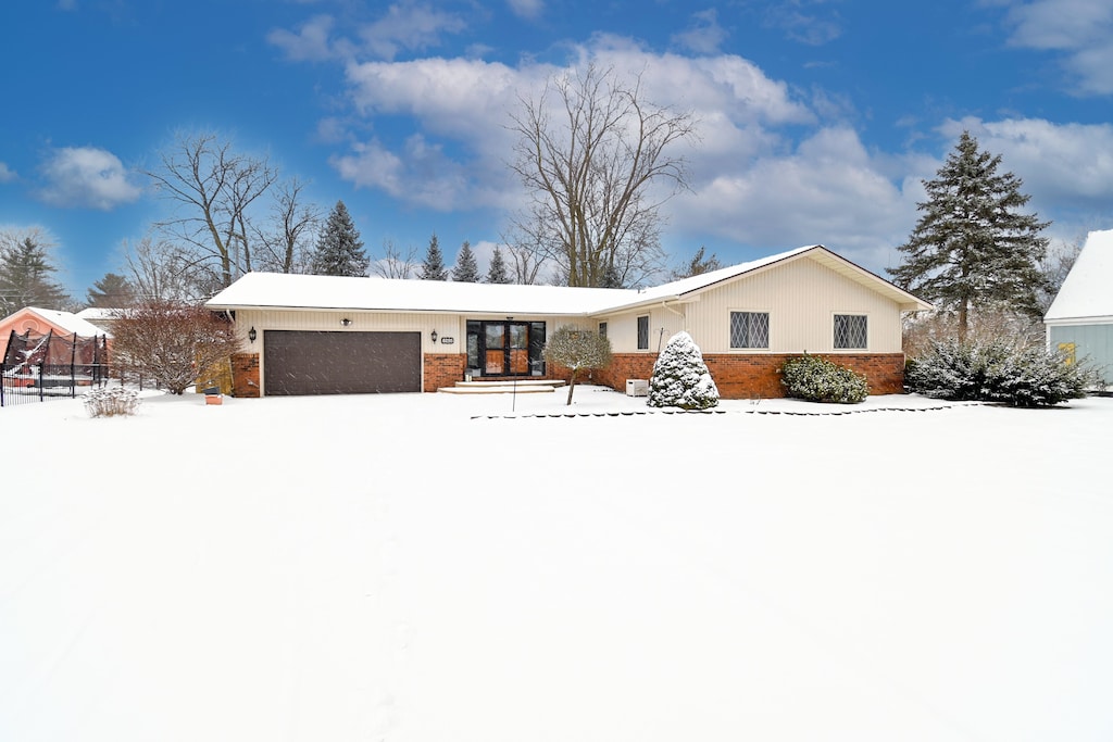 single story home with a garage