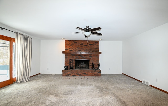 unfurnished living room with carpet, ceiling fan, and a fireplace