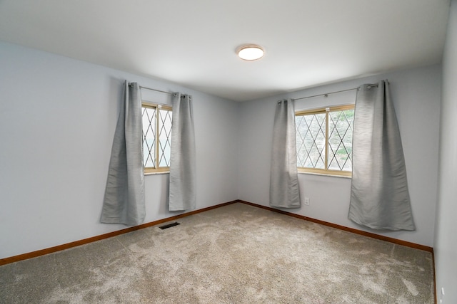 empty room with carpet flooring