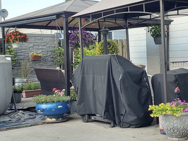 exterior space with a gazebo and grilling area