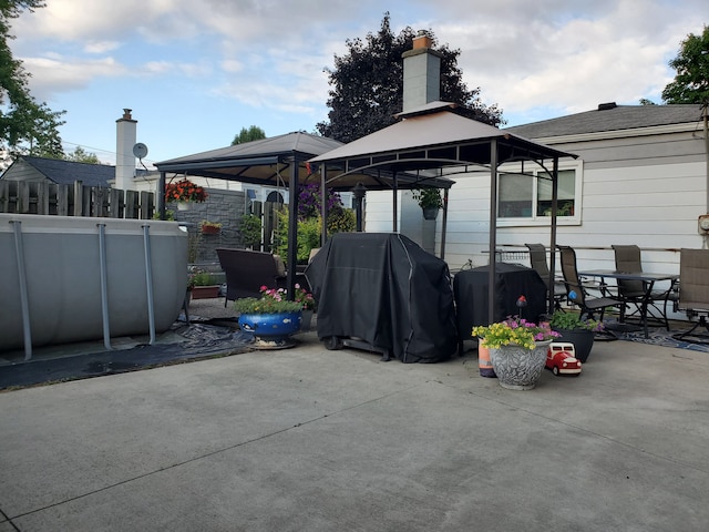 view of patio featuring a gazebo and area for grilling