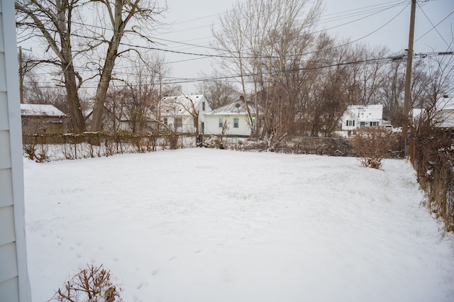 view of yard layered in snow