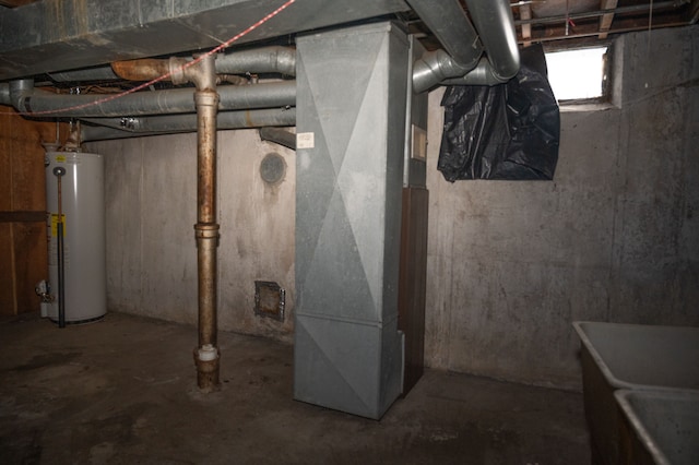 basement featuring heating unit and water heater