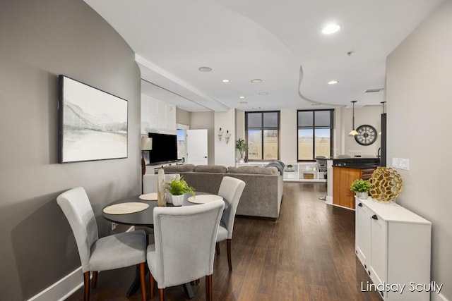 dining area with dark wood-type flooring