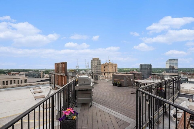 wooden deck featuring area for grilling