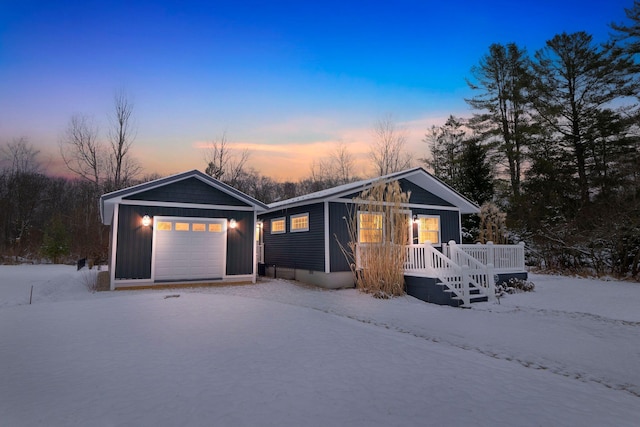 ranch-style house with a garage, an outdoor structure, and a wooden deck