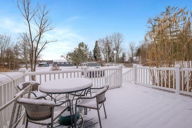 view of snow covered deck