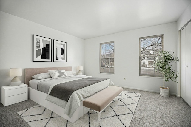 bedroom with light colored carpet and a closet