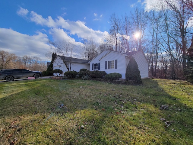 view of home's exterior with a yard