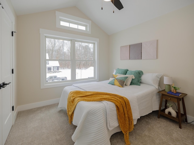 carpeted bedroom with ceiling fan and lofted ceiling