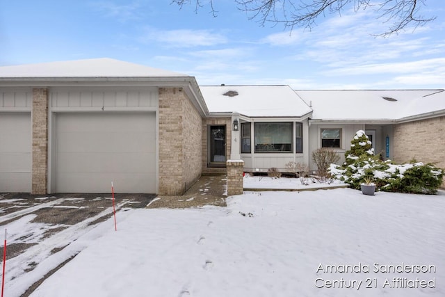 ranch-style house featuring a garage