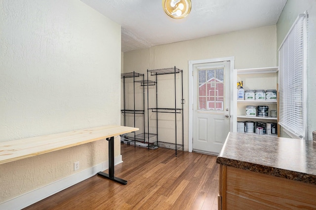 120 N Main St, Climax, MI 49034 - interior space with baseboards, a textured wall, and wood finished floors