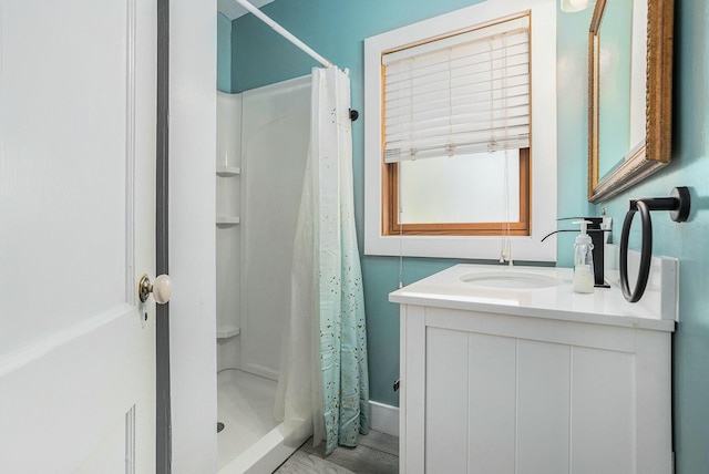 120 N Main St, Climax, MI 49034 - bathroom with vanity, baseboards, and a stall shower