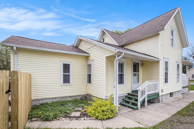 120 N Main St, Climax, MI 49034 - view of front of house featuring roof with shingles and fence