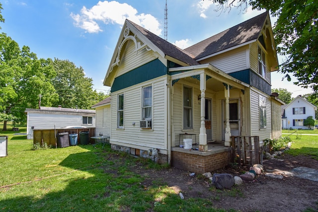 view of property exterior with covered porch and a yard