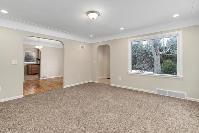 unfurnished room featuring carpet