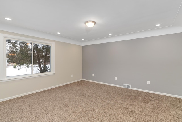 unfurnished room featuring carpet