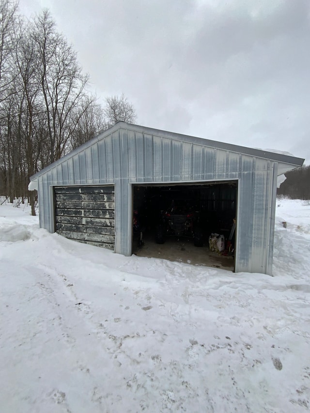 view of snow covered garage