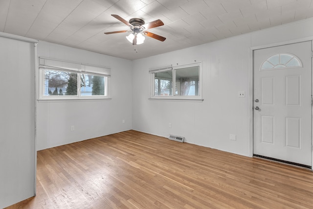 entryway with ceiling fan and light wood-type flooring