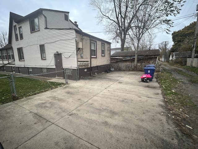 view of side of home featuring a lawn