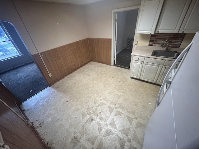 kitchen with wood walls and sink