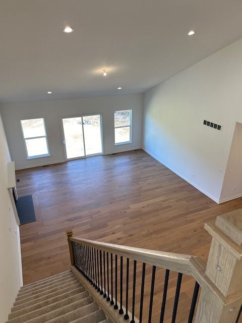 stairs with hardwood / wood-style floors