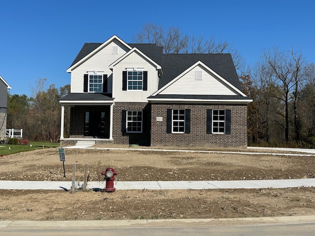 view of front property featuring covered porch