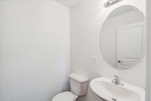 bathroom with toilet and sink