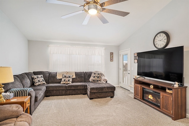 living room with light carpet, ceiling fan, and lofted ceiling