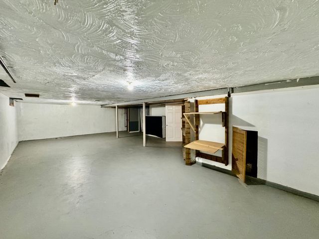 basement with a textured ceiling