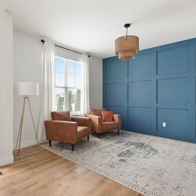 sitting room featuring light hardwood / wood-style floors