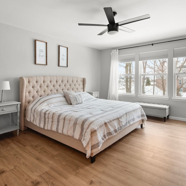 bedroom featuring ceiling fan and light wood-type flooring