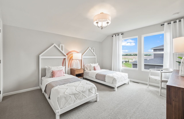 bedroom with carpet and lofted ceiling