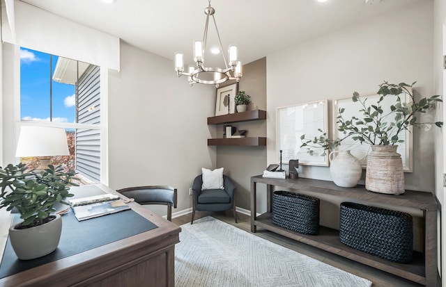 office space featuring hardwood / wood-style floors and a chandelier