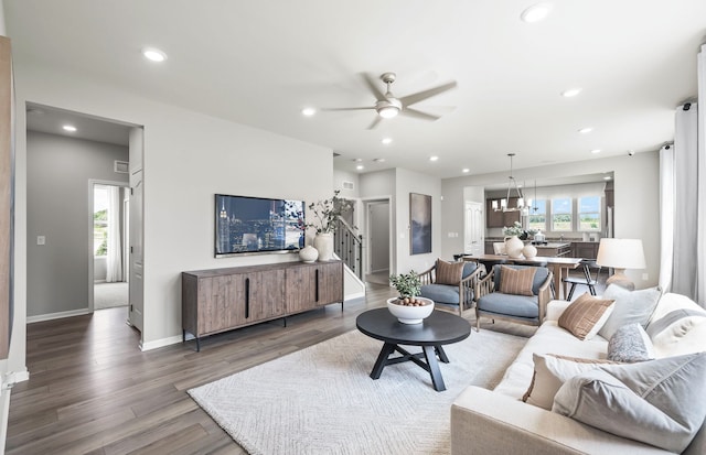 living room featuring ceiling fan, a healthy amount of sunlight, and hardwood / wood-style floors