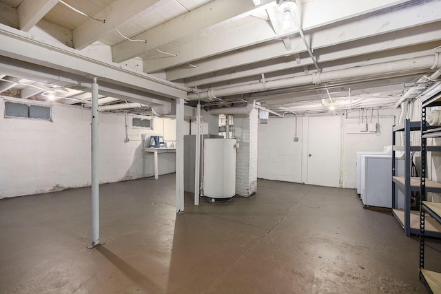 basement featuring separate washer and dryer and gas water heater