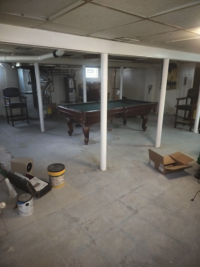 basement with gas water heater and billiards