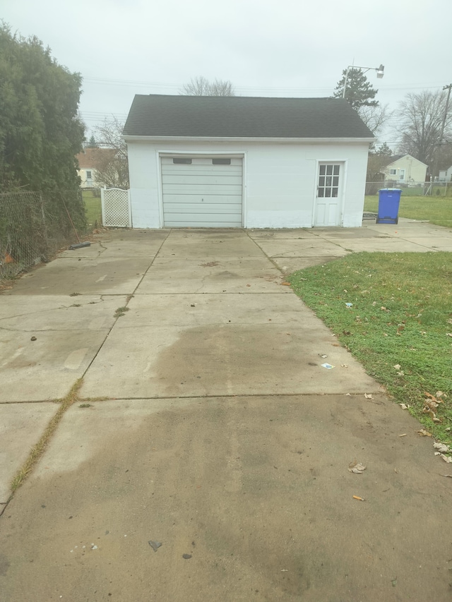 garage with a lawn