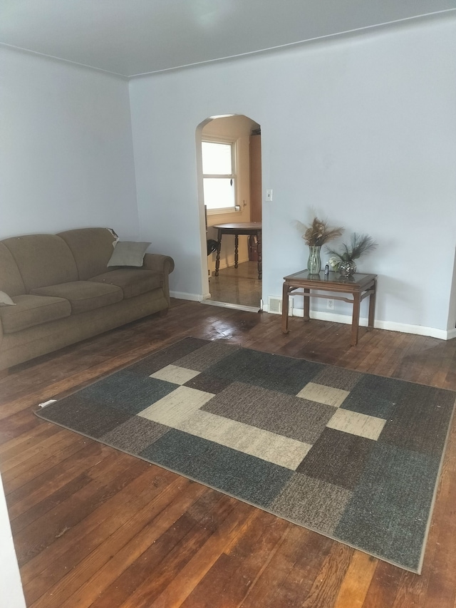 living room with dark wood-type flooring