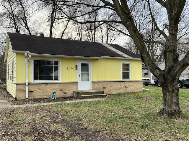 view of front of home with a front yard