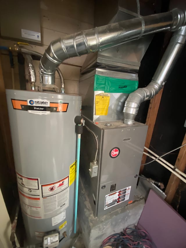 utility room featuring gas water heater